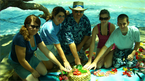 A family spreading ashes at sea of a loved on